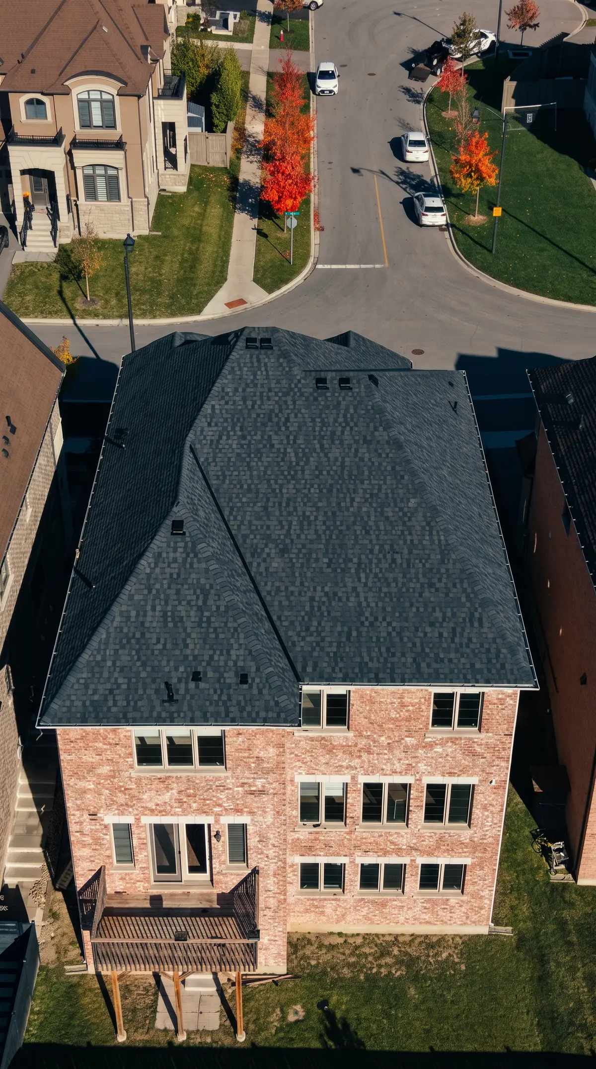 After: the new dark roof over the back of the same home