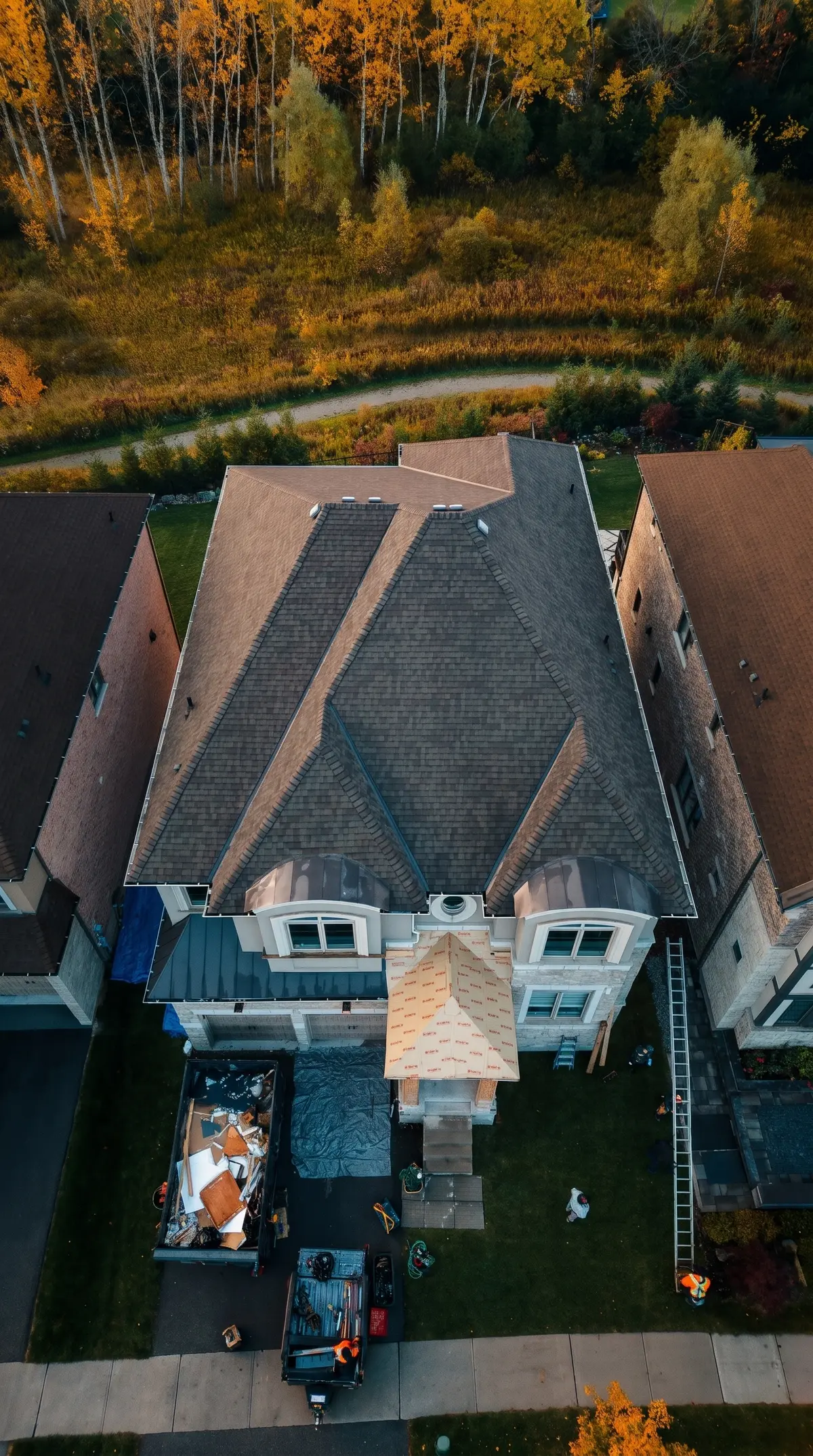 The King City home from above during the job, backing onto woods in fall colour